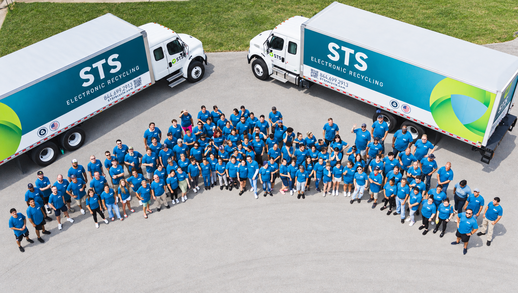 STS Electronic Recycling employees assembled with the company collection fleet